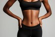 © Olga - A woman is wearing a black tank top and black leggings.