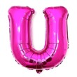 © Li - Bright pink balloon shaped like the letter 'U,' floating playfully against a clean background.