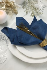 Poster - Christmas place setting with festive decor on white table, above view