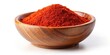 © Latsamee - A close up shot of a wooden bowl filled with a generous amount of smoked paprika placed on a white background at a low angle, low angle, organic, cooking, aromatic, spice, rustic