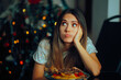 © nicoletaionescu - Sad Unhappy Woman Eating Christmas Dinner Alone. Depressed nostalgic pessimistic lady being disappointed