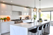 © Emongrapic - Sleek Minimalist Kitchen with High-Gloss White Cabinets, Waterfall Countertops, and Pendant Lights