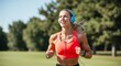 © Arceli - Energized sportswoman taking in the fresh air while listening to music on her headphones