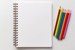 © pueb - Minimalist drawing set featuring watercolor paints, brushes, and notebook on white background