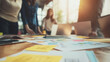 © novri - Team Collaboration During Business Meeting With Charts and Papers