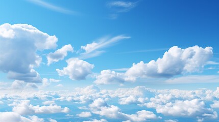 Wall Mural - a bright blue sky with large, puffy clouds drifting by