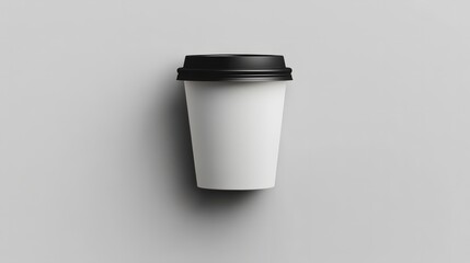 Coffee to Go:  A clean, simple, and minimalist mockup of a single white takeaway coffee cup with a black lid, perfect for branding and design projects.  