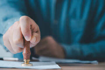 Fototapete - Businessman using wood stamping on document for approve and reject project and financial concept.