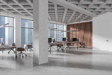 Canvas Print - Stylish coworking room interior with pc computers on table, panoramic window