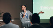 © KayExam/peopleimages.com - Speaker, woman and presentation for innovation workshop or corporate responsibility as employees. Female person, business conference and discussion with mic for project on sustainability for audience