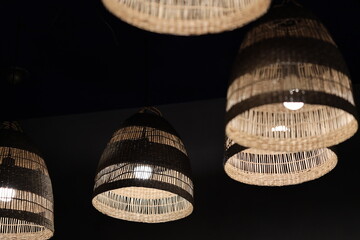 Poster - A collection of pendant lights suspended from a ceiling.
