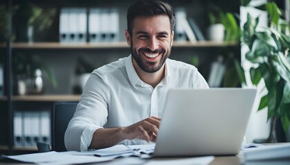 Poster - A Smiling Man Working on a Laptop in an Office Setting