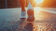 © 69 - Feet of an athlete running on asphalt under bright sunlight, detailed view of shoes and pavement texture, energy and motivation captured
