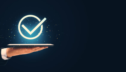Poster - Check mark icon displayed on tablet in hand against dark background.