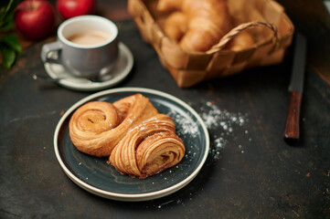 Franzbrötchen an original sweet pastry from Hamburg with a cup of latte