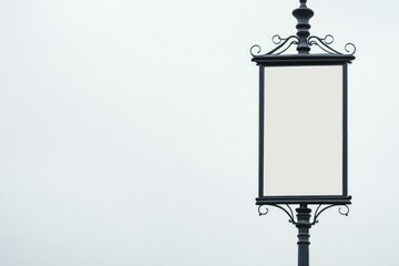 Poster - A street light with a blank sign on the pole, ideal for use in urban landscapes or as a symbol of uncertainty