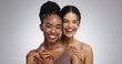 © WesLens/peopleimages.com - Portrait, hug and women with beauty, cosmetics and dermatology on white studio background. Face, friends and people with shine, aesthetic and inclusive grooming with treatment, embrace and skincare