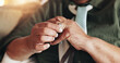 © LuxeShutter24/peopleimages.com - Senior, person and hands with ring for divorce in home for infidelity, marriage fail or doubt in relationship. Closeup, remove jewelry and secret affair in living room with regret or cheating partner