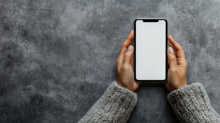 Poster - Woman hands using a smartphone with a blank white screen, isolated on a minimalist background.