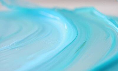 Wall Mural - a close up shot of a swirling blue liquid. the liquid creates abstract patterns and textures.