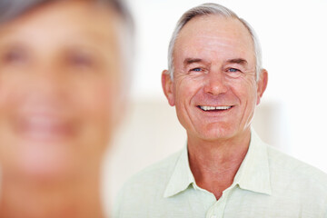 Poster - Home, senior man and happy in portrait for retirement, comfort and laughing with positive attitude. Elderly couple, male person and old woman in marriage for commitment, connection and smile in house