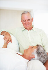 Wall Mural - Senior couple, happy and love on sofa for relax, bonding and trust with support, care and together in home. Elderly people, smile and comfort on couch for weekend break, marriage and holding hands