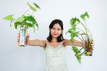 Young Asian Female Gardener Florist With Indoor Garden Plants