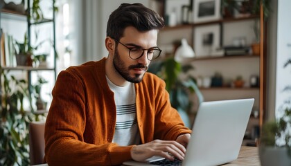 Poster - Man with Glasses Typing on a Laptop in a Home Office Setting