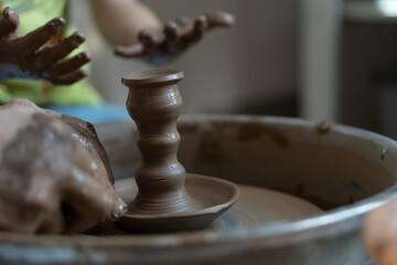 Pottery wheel lesson for adults and children. Making figures from clay.