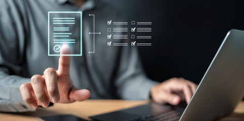 chart, document, graph, management, marketing, strategy, financial, analysis, search, information. A man is using a laptop with a screen that has a check mark on it.