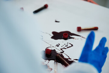 Wall Mural - Scientist, hands and blood samples with mess of DNA for investigation, crime scene or decontamination at lab. Closeup, science and chemical biologist with spill or gloves for safety or disinfection