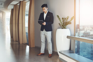 Poster - Asian man, tablet and real estate agent in office building for networking or consulting in company. Male person, technology and working as realtor in property management, development or town planning