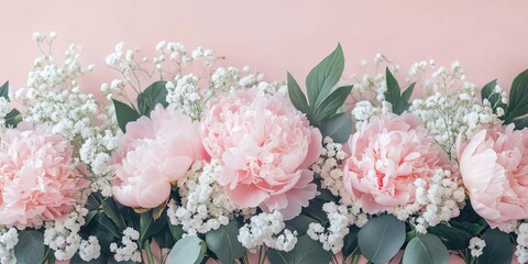  Pink peonies and white baby's breath flowers with green leaves on a pastel pink background.