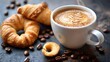 © Thaniya - Cup of creamy cappuccino served with two freshly baked croissants. Professional cafe photoshoot captures a cozy, inviting presentation, showcasing a classic cafe menu item on dark textured surface.