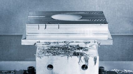 Poster - A piece of metal is being shaped by a machine. The metal is covered in small pieces of metal, which are the result of the machine's work. Concept of progress and transformation