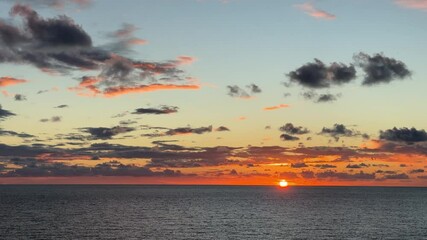 Wall Mural - Red sunset, sky dark clouds and sea.