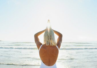 Poster - Beach, prayer hands and back of woman with meditation for chakra balance, mindfulness and awareness. Zen, person and calm with peace by ocean waves for holistic healing, exercise and mental health