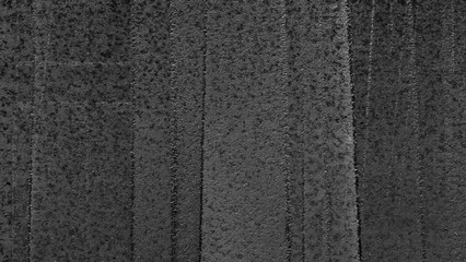 Poster - A black metal wall with a black and white pattern. The photo has a moody and mysterious feel to it