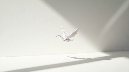 Wall Mural -   A white origami bird soaring in the air with a shadow on the wall, centering the room