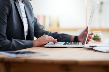 Poster - Businessman, hands and typing with laptop for research, communication or day trading at office. Closeup, man or employee on computer for online investment, browsling or scrolling on desk at workplace