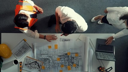 Poster - top down view of project manager shaking hand with civil engineer at meeting table with blueprint sa