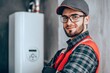 © Maxim Borbut - Focusing on his hand, a repairman fixes a broken electric boiler or furnace. High quality data-driven stock