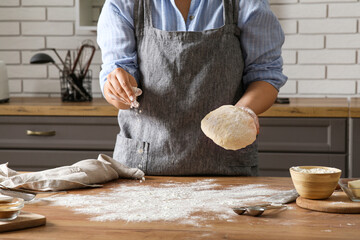 Sticker - Woman preparing traditional cinnamon rolls in kitchen