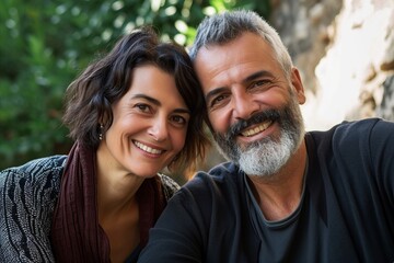 portrait of happy senior couple embracing in garden. focus on man