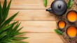 © NATTAWUT - Top view of a serene tea ceremony scene with teapot, teacups, and tea accessories beautifully arranged on a natural table