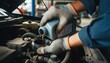 © RHDOSTOCKER - A mechanic pours brake fluid into a car's reservoir