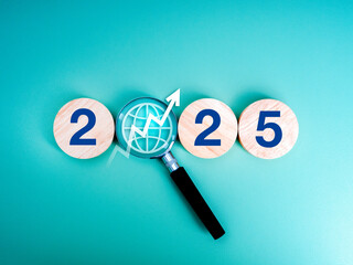 Wall Mural - 2025 Happy new year with online business trends searching concept. 2025 calendar number with digital world icon and rise arrow focus in magnifying glass, isolated on blue background, minimal style.