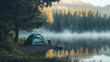 © Vocket - A serene camping scene with a tent set up by a lake, with morning mist rising over the water