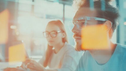 Blur, defocus Background banner IT startup. UX developer and a UI designer are brainstorming over a holographic AR interface in a modern office. mobile app interface. Creative digital development.