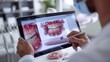 © scardstocks - Dentist showing a patient their dental treatment plan on a digital screen